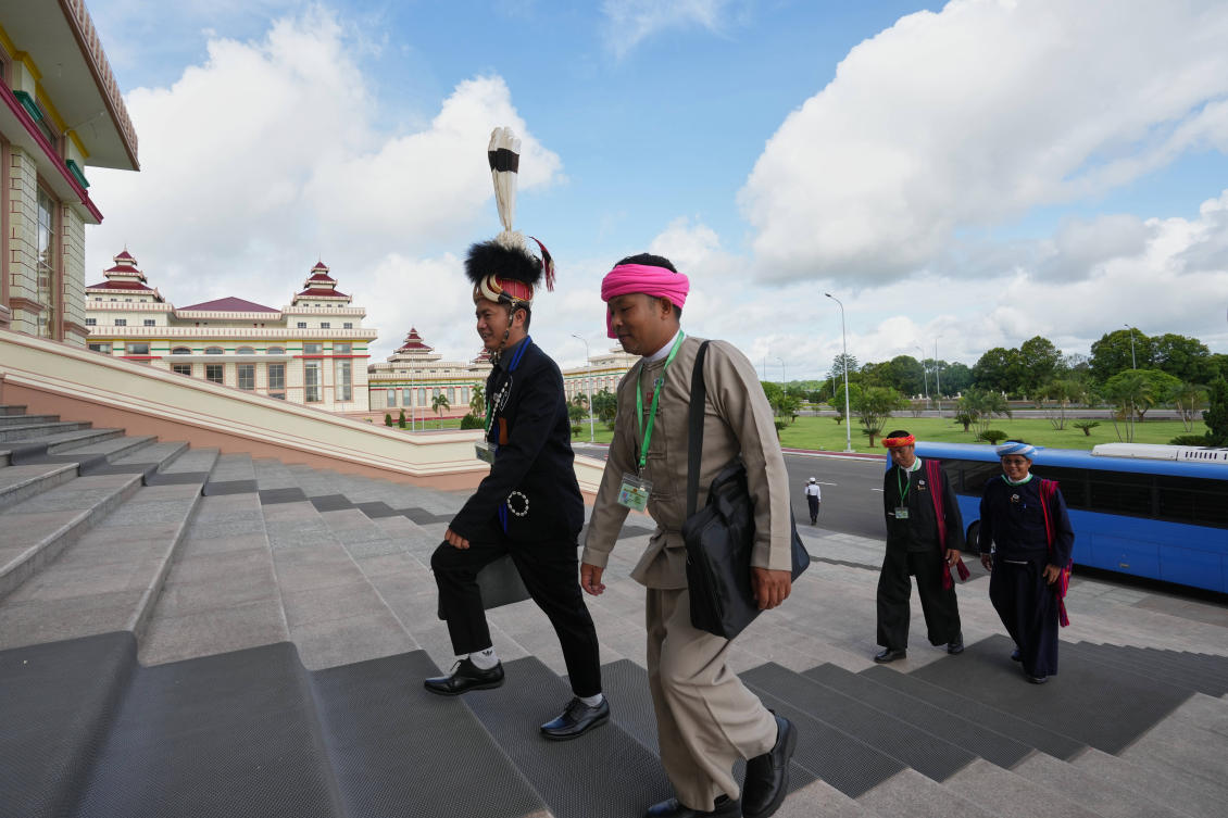 Ethnic lawmakers arrive to attend a regular session of the lower house parliament in Naypyitaw, Myanmar, Friday, June 12, 2026. (AP Photo/Aung Shine Oo)