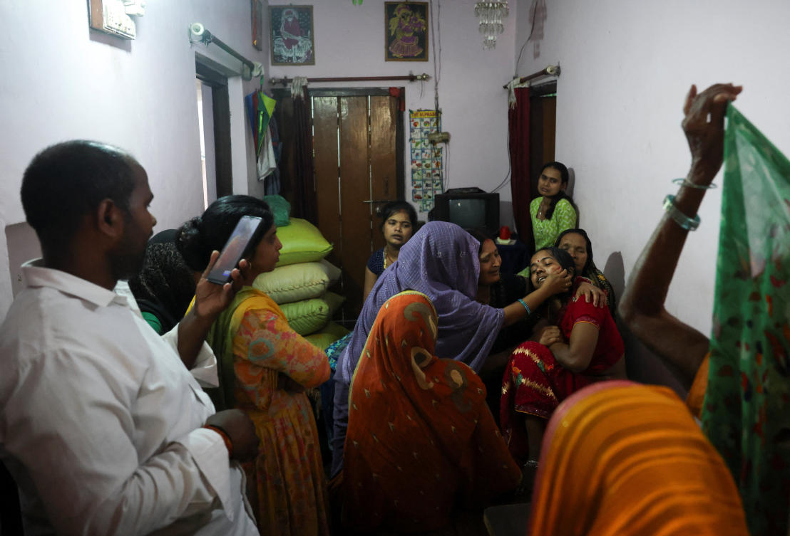 Relatives of Shivanand Chaurasia, an Indian seafarer aboard the Palau-flagged tanker MT Settebello, who was among three crew members killed in one of the US attacks, mourns in Deoria, Uttar Pradesh on June 12, 2026. (Reuters)