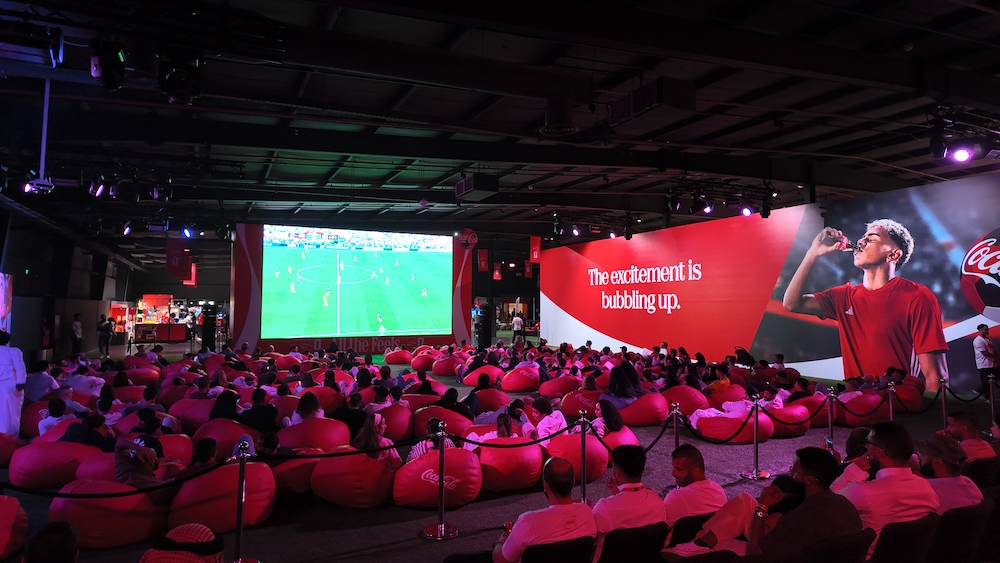 Fans gather at the opening night of the Coca-Cola Fan Zone in Diriyah's JAX District. (AN Photo)