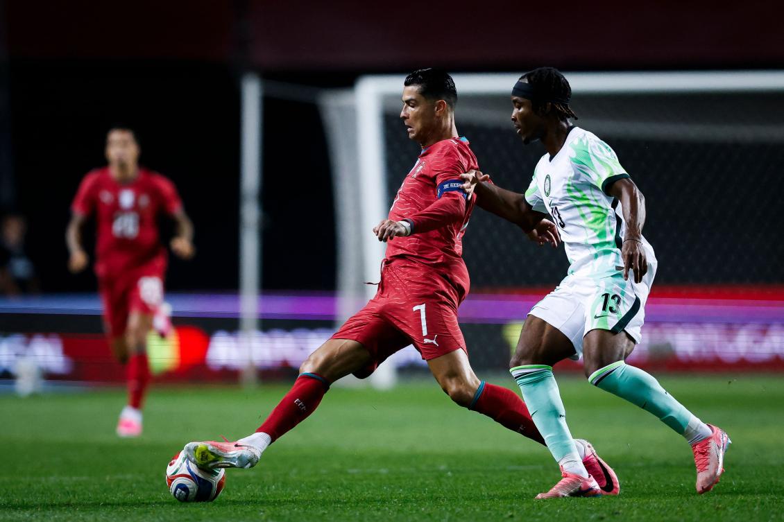 Portugal’s forward Cristiano Ronaldo fights for the ball with Nigeria’s defender Bruno Onyemaechi during their international friendly at Magalhaes Pessoa Stadium in Leiria, on Jun. 10, 2026. (AFP)