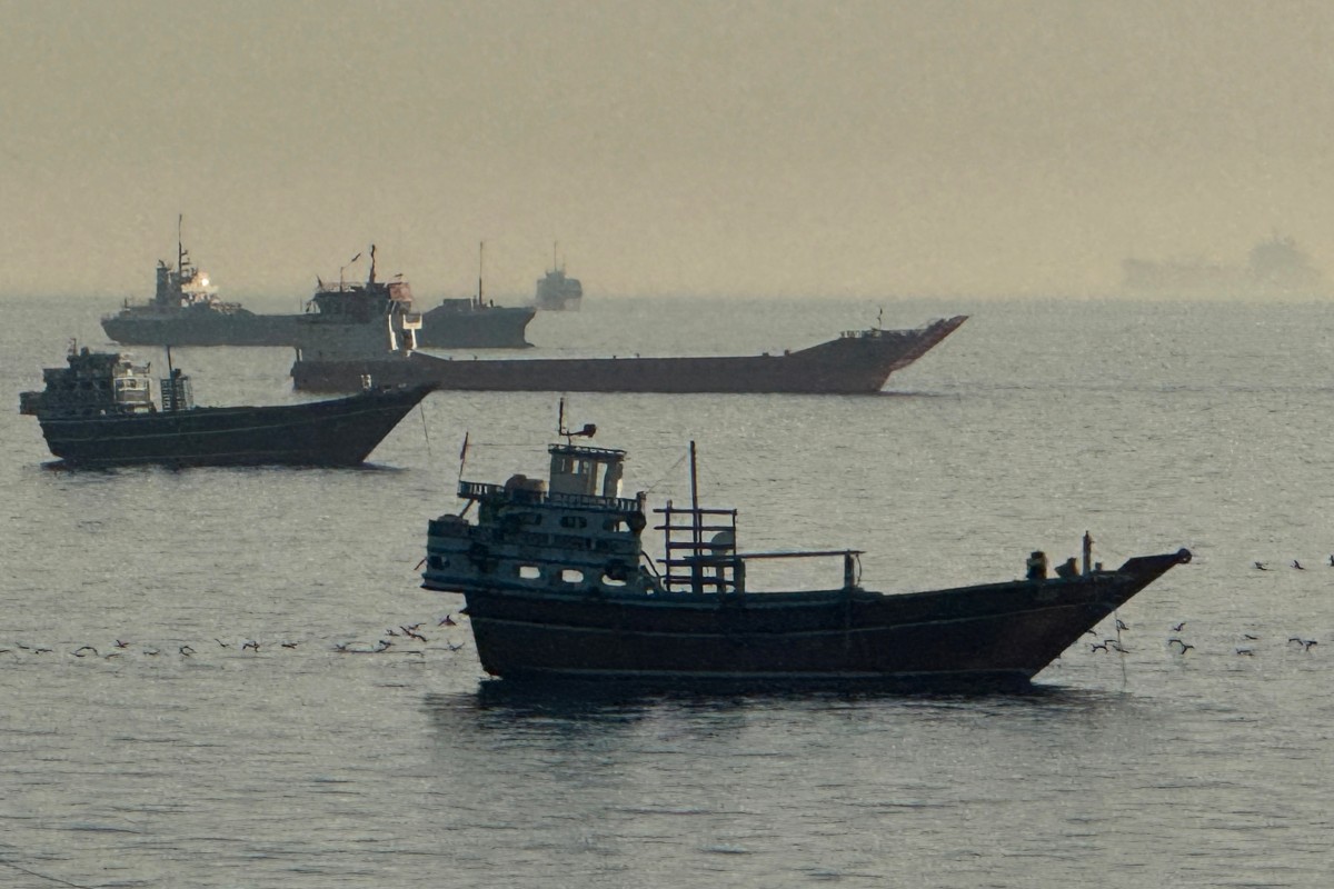 Vessels are seen anchored in the Strait of Hormuz, off the port city of Khasab on Oman’s northern Musandam Peninsula on May 17, 2026. (AFP)
