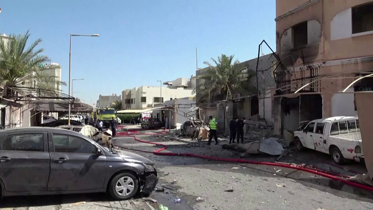 Footage released by Bahrain TV shows damage to buildings and vehicles in Bahrain reportedly caused by debris from intercepted drones, June 11, 2026. (AFP)