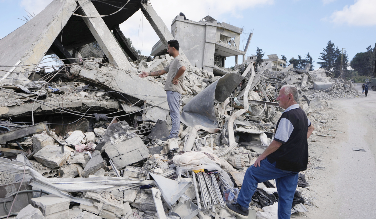 Returning home after a US-Iran ceasefire, residents survey the destruction of their house in Beer Al-Salassel, southern Lebanon, on Monday. (AP)