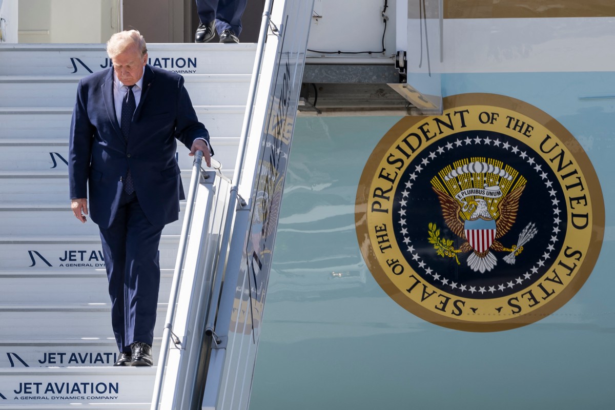 US President Donald Trump disembarks Air force One after landing at the Geneva airport ahead of the G7 summit, in Geneva, June 15, 2026. (AFP)