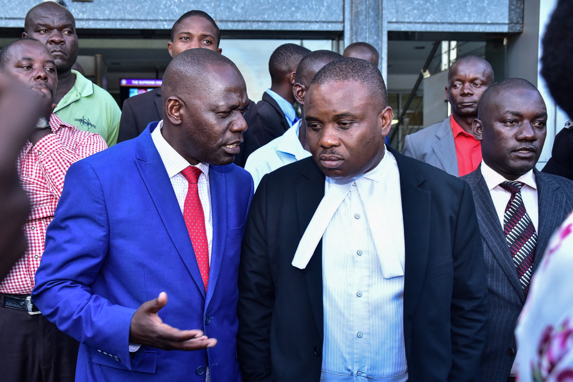 Erias Lukwago (2nd R) was taken from his house by armed soldiers. (AFP)