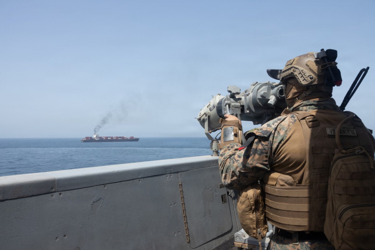 This US Navy handout photograph released on April 21, 2026, by US Central Command Public Affairs shows US forces patrolling the Arabian Sea near the Touska, an Iranian-flagged cargo ship, on April 20, 2026. (AFP)