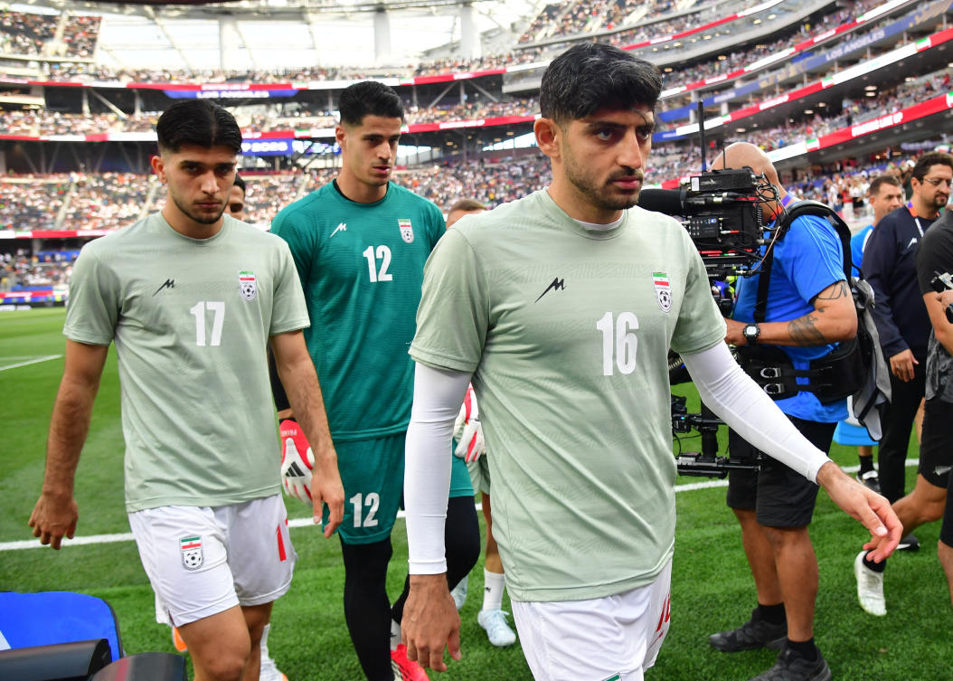 Iran's Mehdi Torabi, Arya Yousefi and Payam Niazmand during the warm up before the match in Los Angeles Stadium, Inglewood, California, US - June 15, 2026 (Reuters)