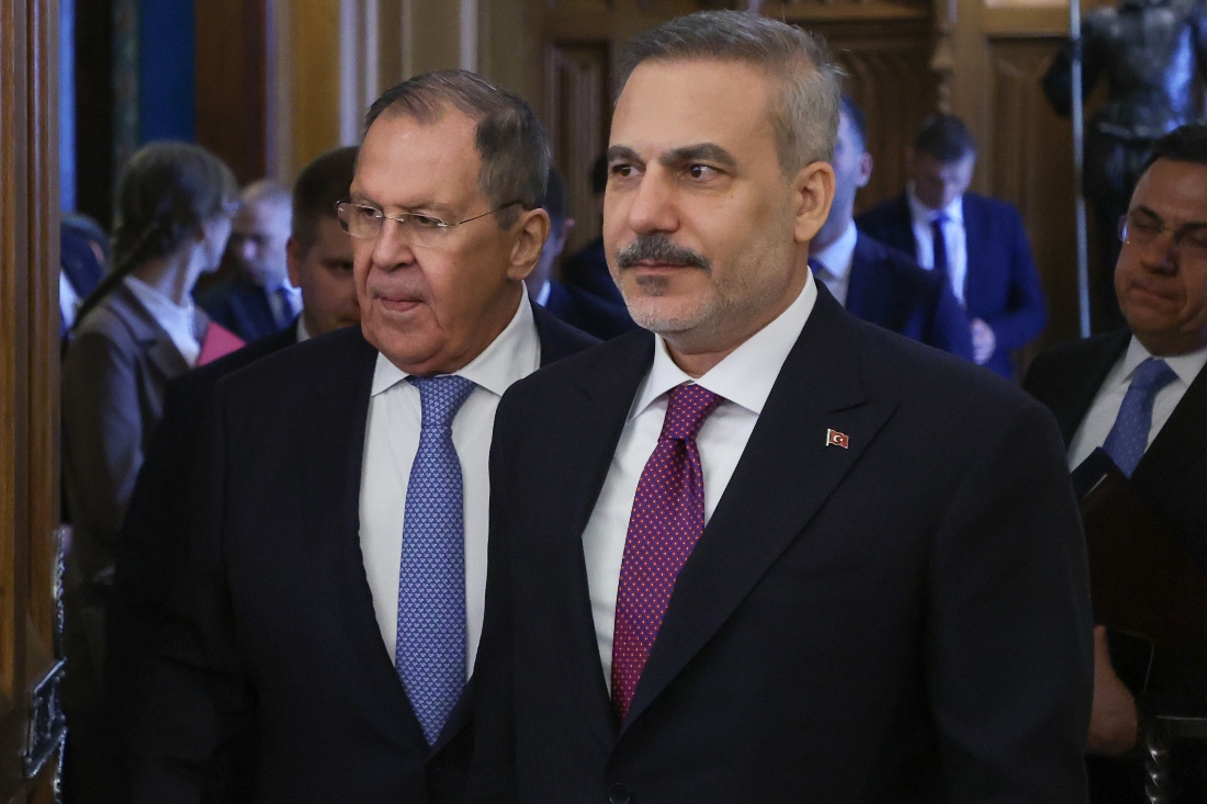 Russian Foreign Minister Sergey Lavrov and Turkish Foreign Minister Hakan Fidan enter a hall for their talks at Zinaida Morozova's Mansion in Moscow, Russia. (AP)
