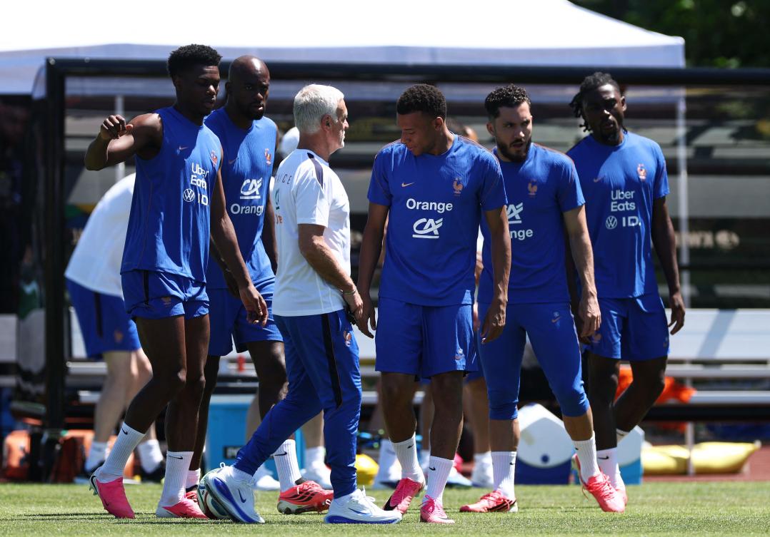 France’s midfielder Aurelien Tchouameni, forward Jean-Philippe Mateta, head coach Didier Deschamps, forward Kylian Mbappe, Rayan Cherki and midfielder Manu Kone attend a training session at Bentley University, the team’s base camp, during the 2026 World Cup in Waltham, near Boston, on Jun. 14, 2026. (AFP)