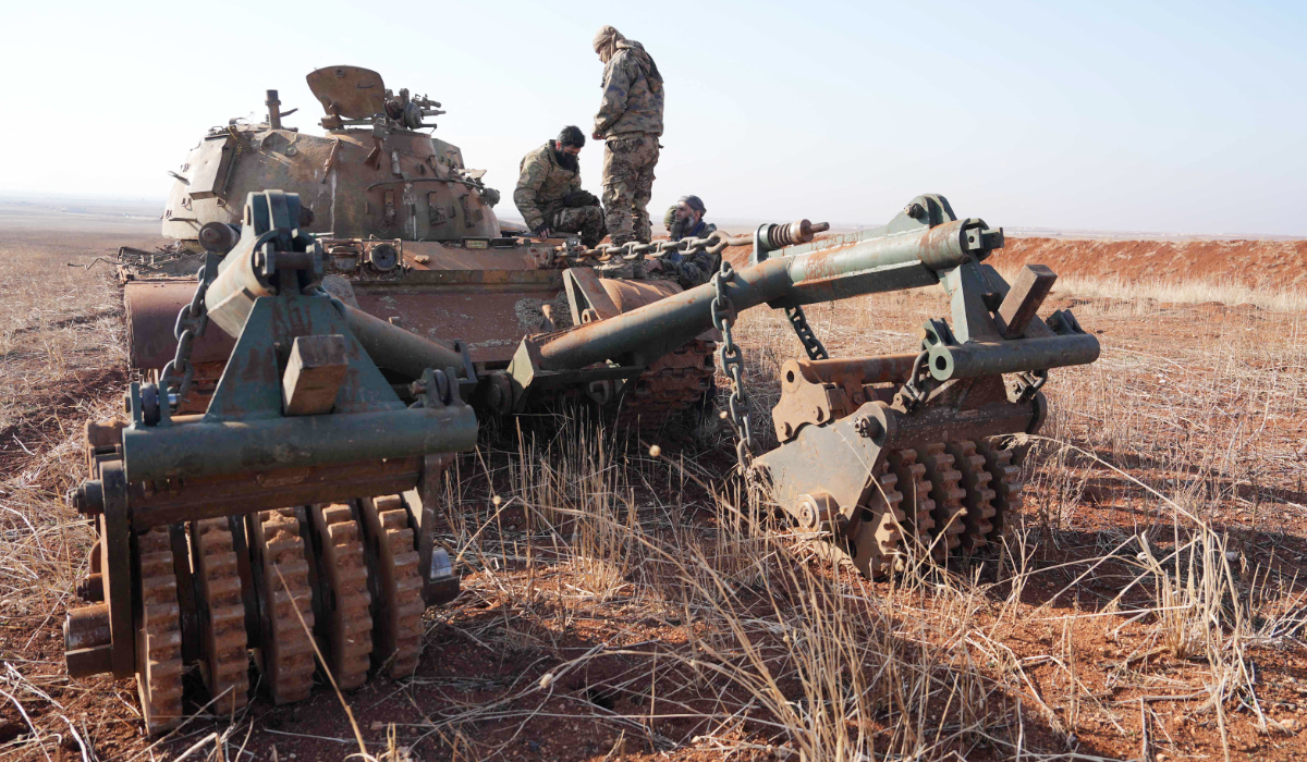Rebel fighters clear mines in a field in the town of Saraqib, Syria, on December 21, 2024. (AFP file photo)
