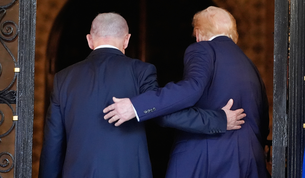 President Donald Trump and Israel's Prime Minister Benjamin Netanyahu walk into Trump's Mar-a-Lago club, Monday, Dec. 29, 2025, in Palm Beach, Fla., after an arrival greeting. (AP)