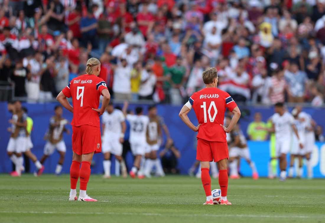 Norway's Martin Odegaard and Norway's Erling Haaland react after Iraq's Aymen Hussein scored their first goal. (Reuters)