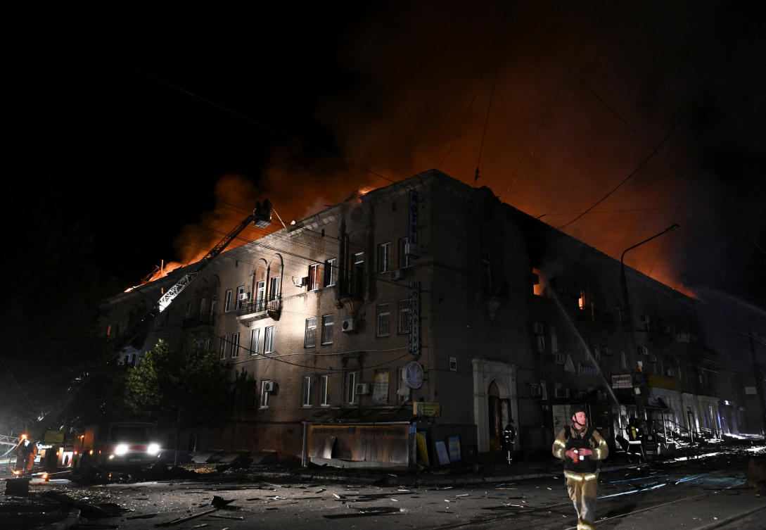 Firefighters work at a site of an apartment building hit by a Russian drone strike, amid Russia's attack on Ukraine, in Zaporizhzhia, Ukraine June 16, 2026. REUTERS/Stringer