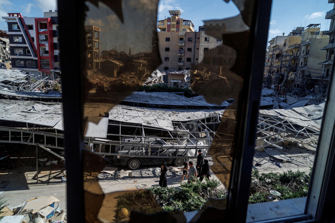 Above, residents walk past rubble at the site of an earlier Israeli strike in Tyre, southern Lebanon on June 16, 2026. (Reuters)