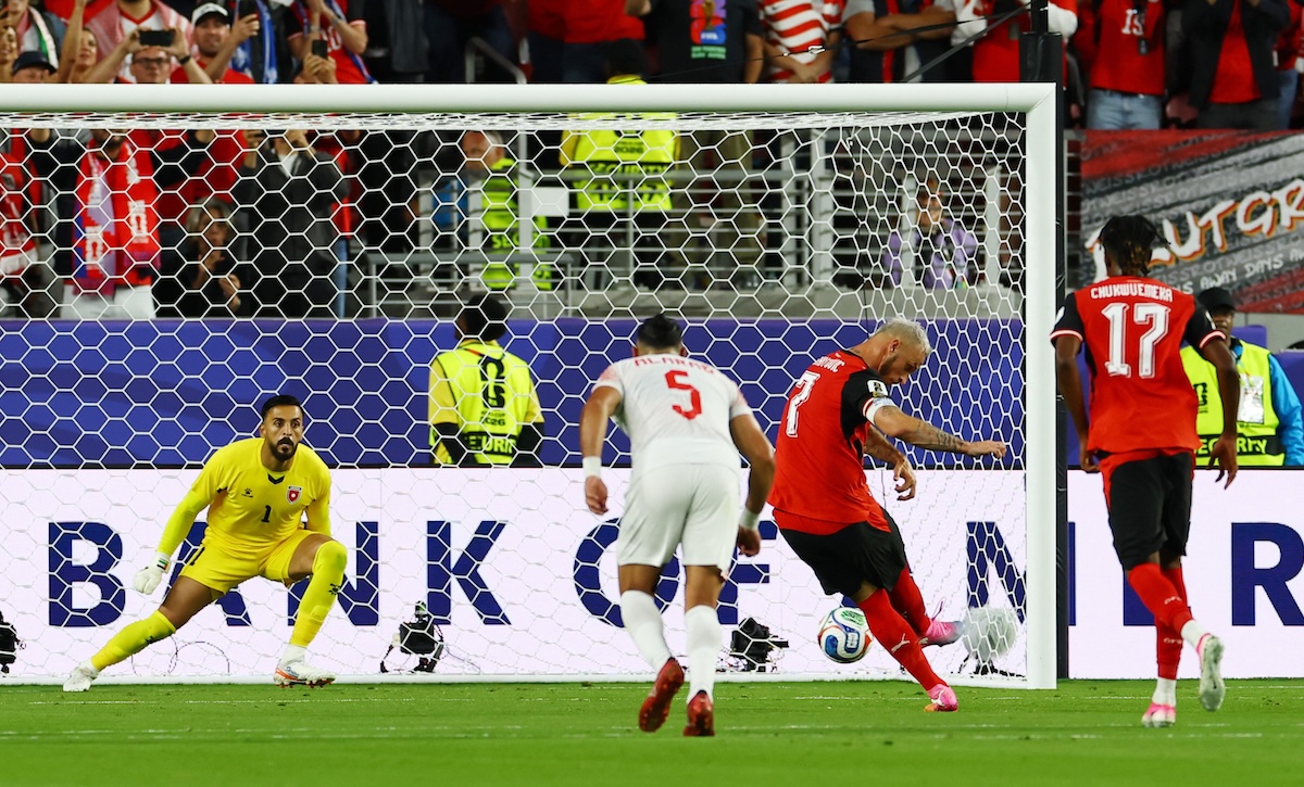 Above, Austria’s Marko Arnautovic scores their third goal from the penalty spot. (Reuters)