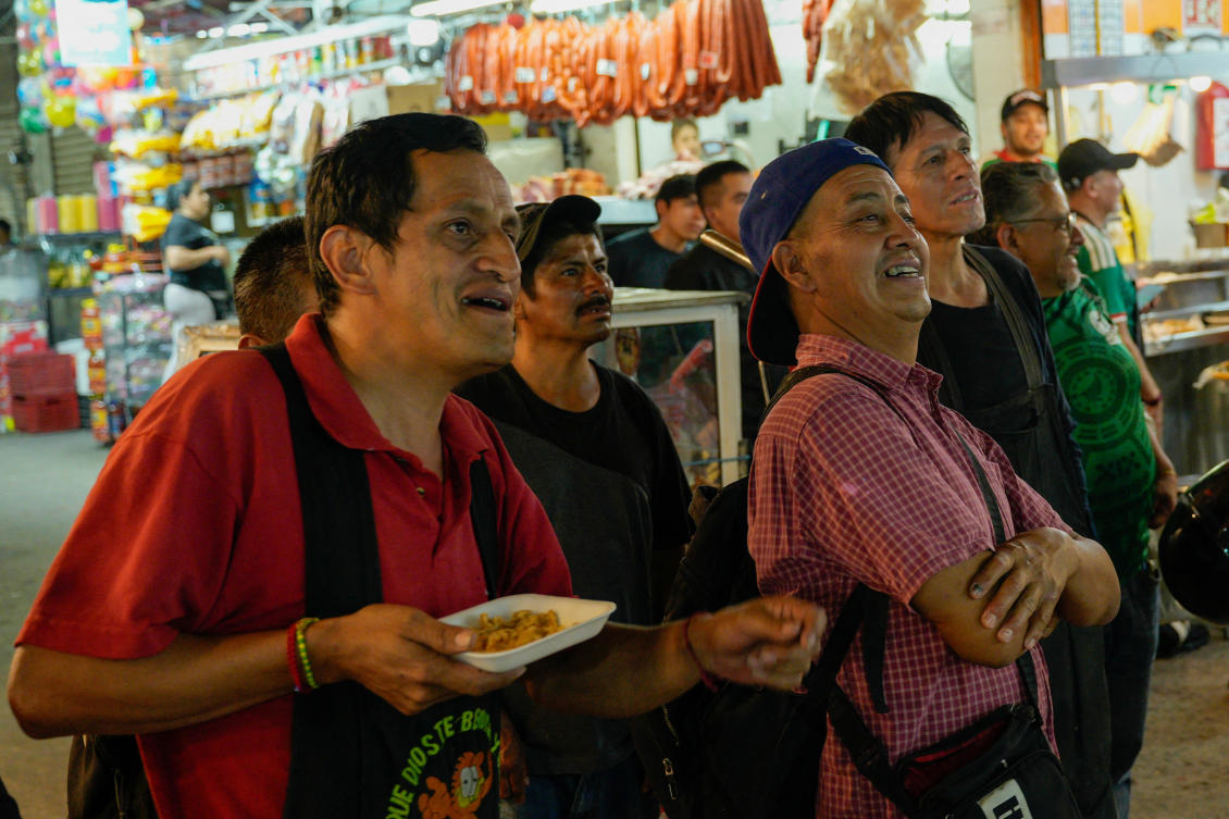 Workers watch the opening match of the 2026 FIFA World Cup on a TV in the Central de Abastos wholesale market, as many Mexicans say they feel excluded despite the tournament’s return to the country, citing high ticket prices, paid television access and strict commercial restrictions, in Mexico City, Jun. 11, 2026. (Reuters)