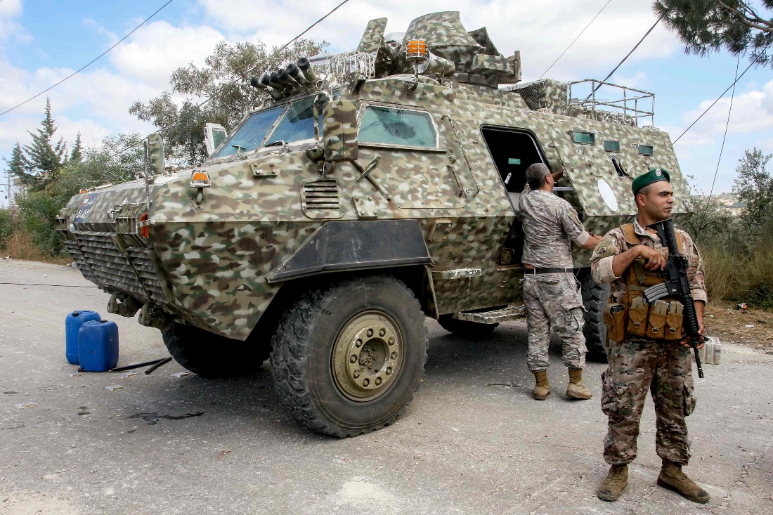 Lebanese army forces set up a checkpoint at the entrance of the village of Ghandourieh in southern Lebanon. (AFP)