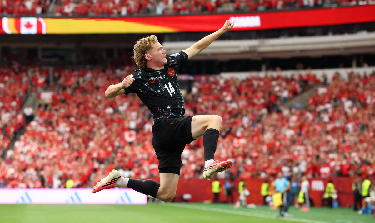 Jacob Shaffelburg #14 of Canada celebrates the team's fifth goal scored own goal by Mohamed Manai #26 of Qatar during the FIFA World Cup 2026 Group B match between Canada and Qatar at BC Place Vancouver on June 18, 2026 in Vancouver, British Columbia. (AFP)