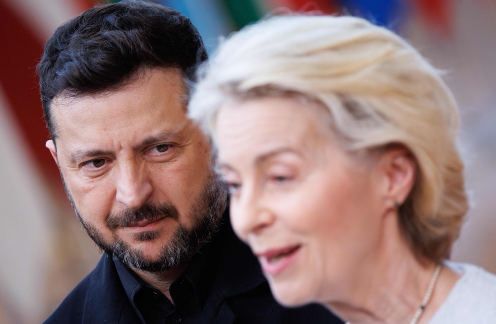 Ukraine's President Volodymyr Zelensky looks on as European Commission President Ursula von der Leyen delivers remarks to journalists. (BELGA/AFP)