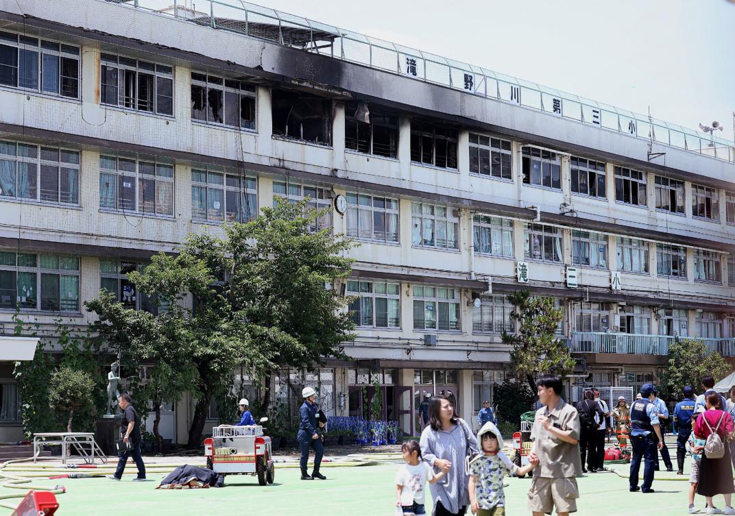 Above, Takinogawa Dai-san Elementary School, where a fire broke out on the fourth floor of the school building in Tokyo on June 19, 2026. (Jiji Press/AFP)