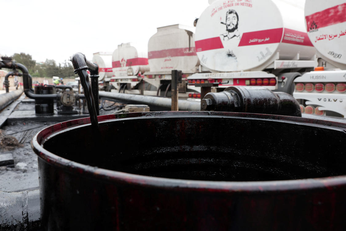 A barrel being filled with oil delivered from Iraq at the oil terminal of Baniyas, Syria, May 14, 2026. (Reuters)