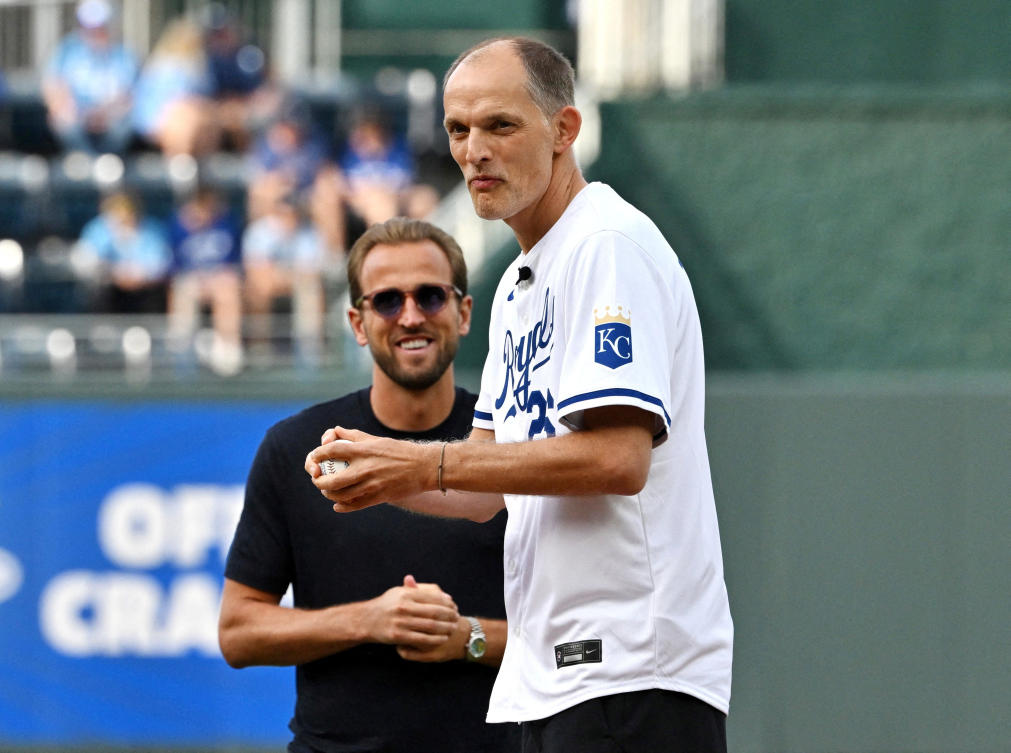 England manager Thomas Tuchel throws a ceremonial first pitch before the game at the St. Louis Cardinals vs Kansas City Royals MLB game in Kansas City as Harry Kane looks on — FIFA World Cup 2026 — Kauffman Stadium, Kansas City, Jun. 18, 2026 (Reuters)