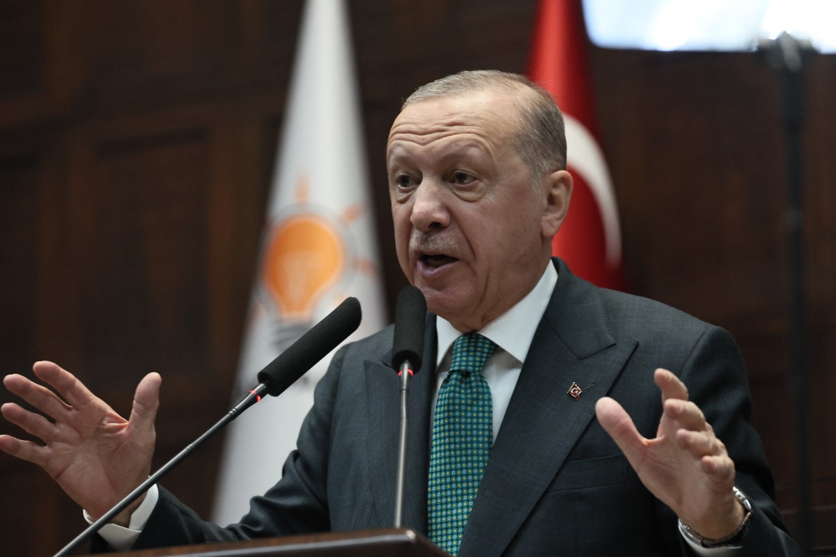 Turkish President and the leader of the Justice and Development Party (AKP) Recep Tayyip Erdogan gestures as he gives a speech during his party's parliamentary group meeting at the Turkish Grand National Assembly in Ankara on February 11, 2025. (AFP)