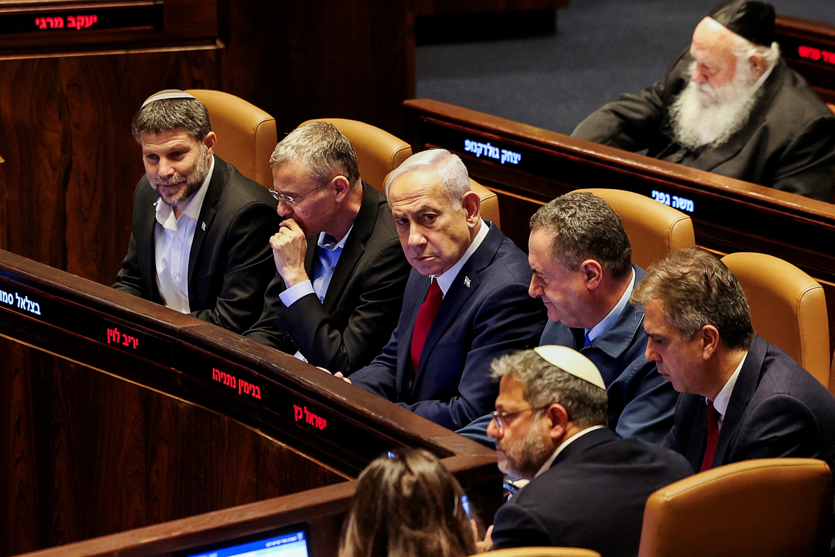 The survey found that even among voters who support the right-wing bloc, the electoral base of Prime Minister Benjamin Netanyahu (C), 93.1 percent believed Iran had won. (Reuters/File Photo)