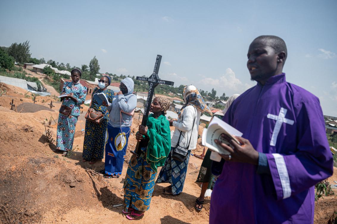 A priest conducts a blessing ceremony at Mbiyo cemetery for a fourth orphan who died from Ebola virus disease at an orphanage in Bunia, Ituri Province, June 19, 2026. (AFP)