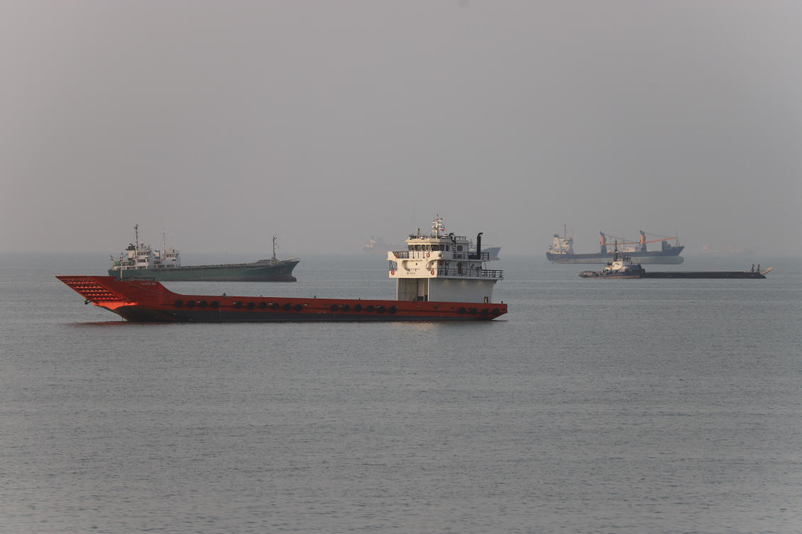 Vessels in the Strait of Hormuz near the beach of Bandar Abbas, Iran, June 21, 2026. (Reuters)
