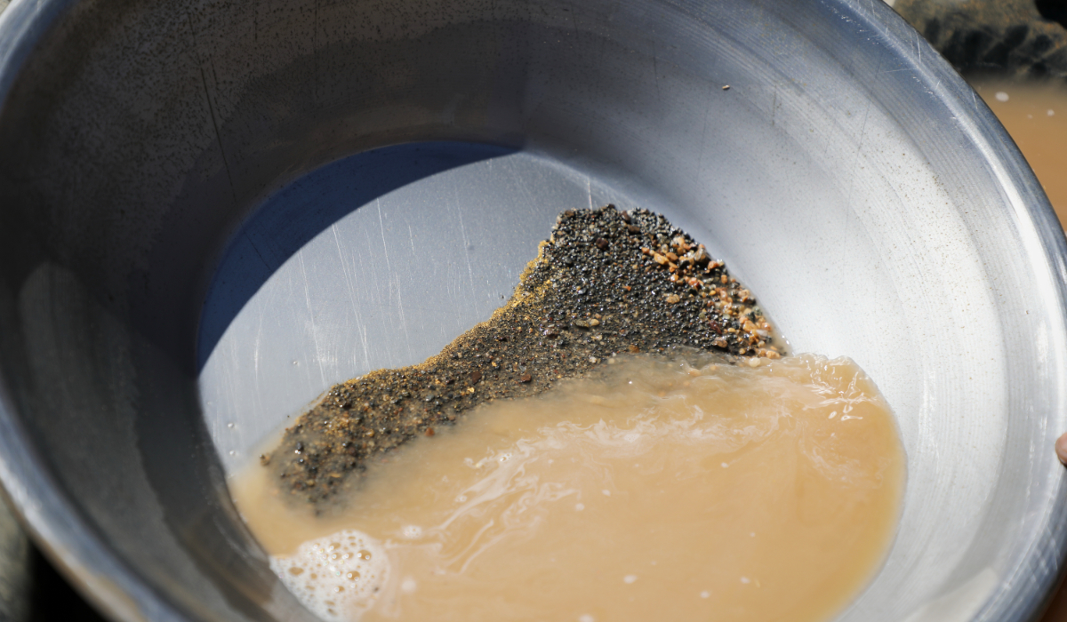 A pan containing gold-bearing sediment and heavy mineral concentrate sits at an artisanal mining site in Dalago Mahas, Sudan's Northern State,Friday, May 8, 2026. (AP)