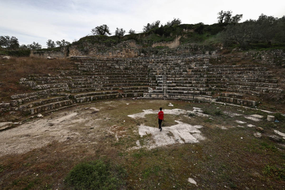 A boy walks in the amphitheatre at the archaeological site of Sebastia, west of the occupied West Bank city of Nablus, Feb. 12, 2026. (Files/AFP)