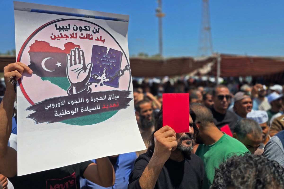 Libyans take part in a demonstration in front of the UNHCR office in Tripoli, demanding the departure of UNHCR and the closure of its offices and declaring ‘No to foreign settlement in Libya’, June 4, 2026. (AFP)