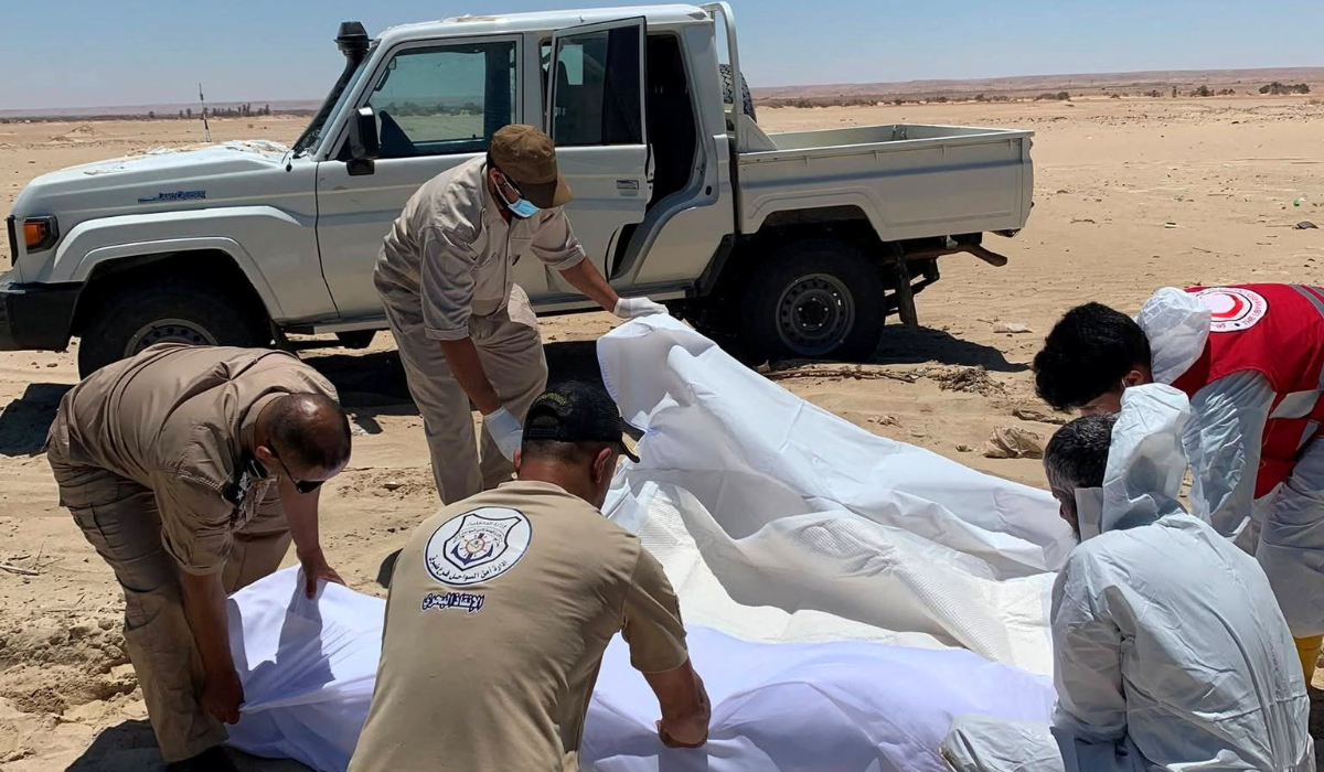 Members of the Search and Rescue Department of Libyan Coastal Security use a white cloth to wrap a body believed to be that of an undocumented migrant that washed ashore and is being loaded onto the back of a vehicle in a location given as eastern Libya, in this handout picture released June 23, 2026. (REUTERS)