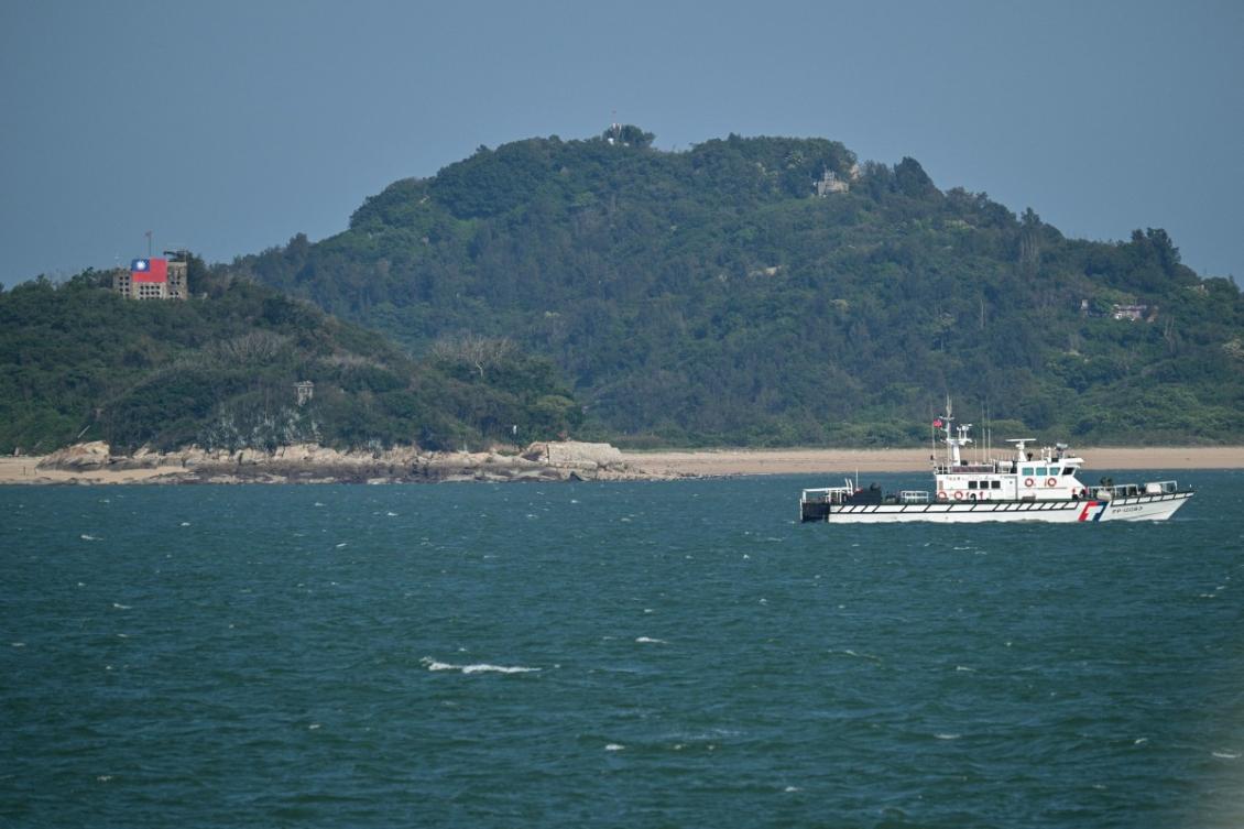 A Taiwan Coast Guard boat patrols, as seen from a boat with Chinese tourists, to observe Taiwan's Kinmen Islands, off Xiamen in China’s southeastern Fujian province on May 25, 2026. (AFP)