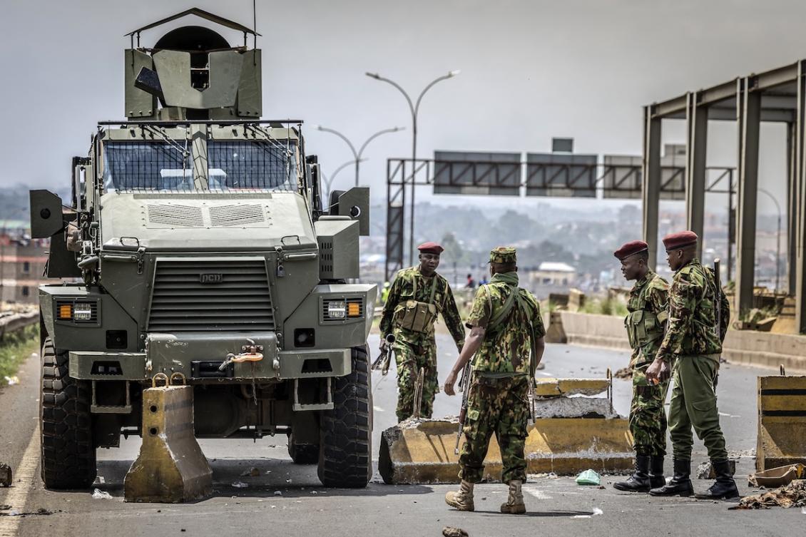Kenyan police officers attempt to restore traffic flow and remove barricades blocking a main highway during a nationwide transport strike over rising fuel prices in Nairobi on May 18, 2026. (FILE/AFP)