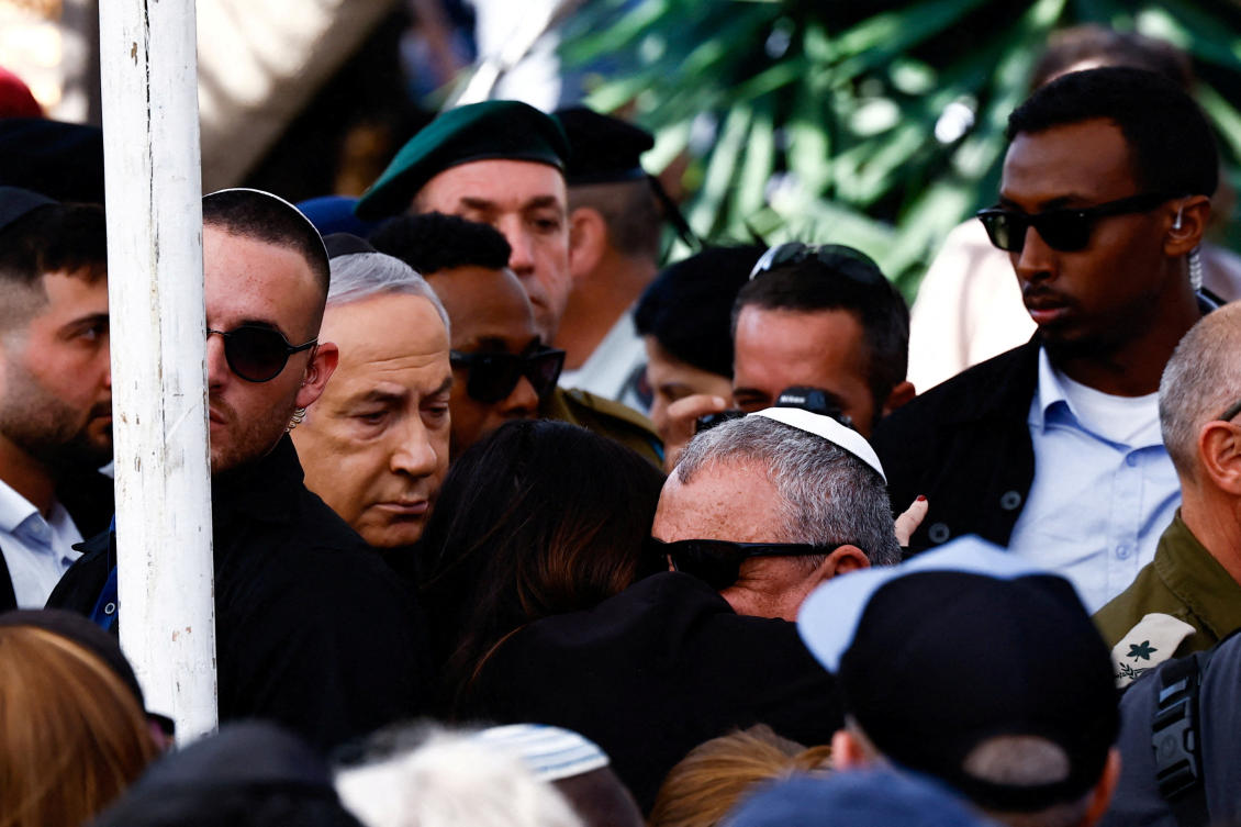 Israeli cabinet minister and former military chief Gadi Eisenkot is consoled by a mourner, as Israeli Prime Minister Benjamin Netanyahu reacts, during the funeral of Gal Meir Eisenkot, 25, an Israeli solider, who was killed in northern Gaza during the ongoing ground operation by Israel's military in the Gaza Strip, in Herzliya, Israel, December 8, 2023. (REUTERS)