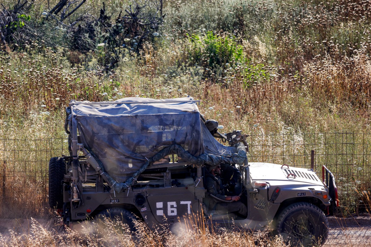An Israeli army humvee vehicle patrols along the northern road near Moshav Margaliot in the Upper Galilee bordering Lebanon. (AFP)