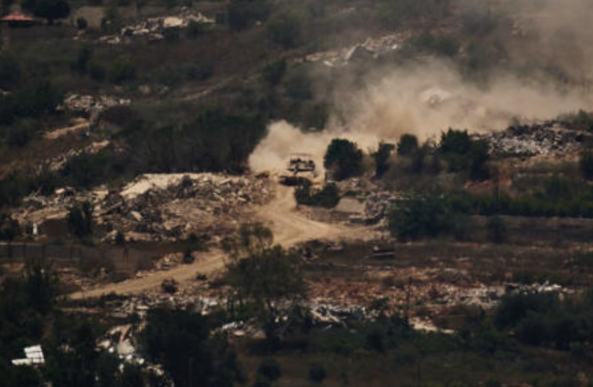 An Israeli tank moves past destroyed buildings in southern Lebanon as seen from northern Israel, Jun. 26, 2026. (AP)