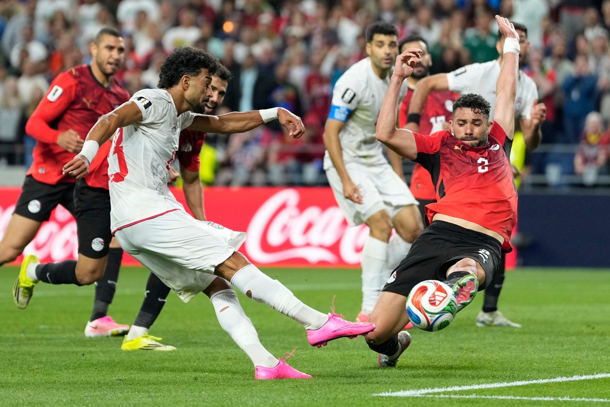 Egypt reach World Cup knockouts but dramatic draw with Iran denies them group top spot