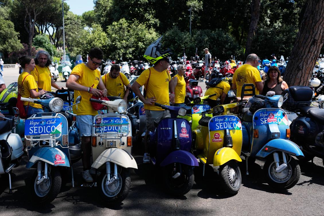 Vespa riders take to roads in Rome to mark 80th birthday