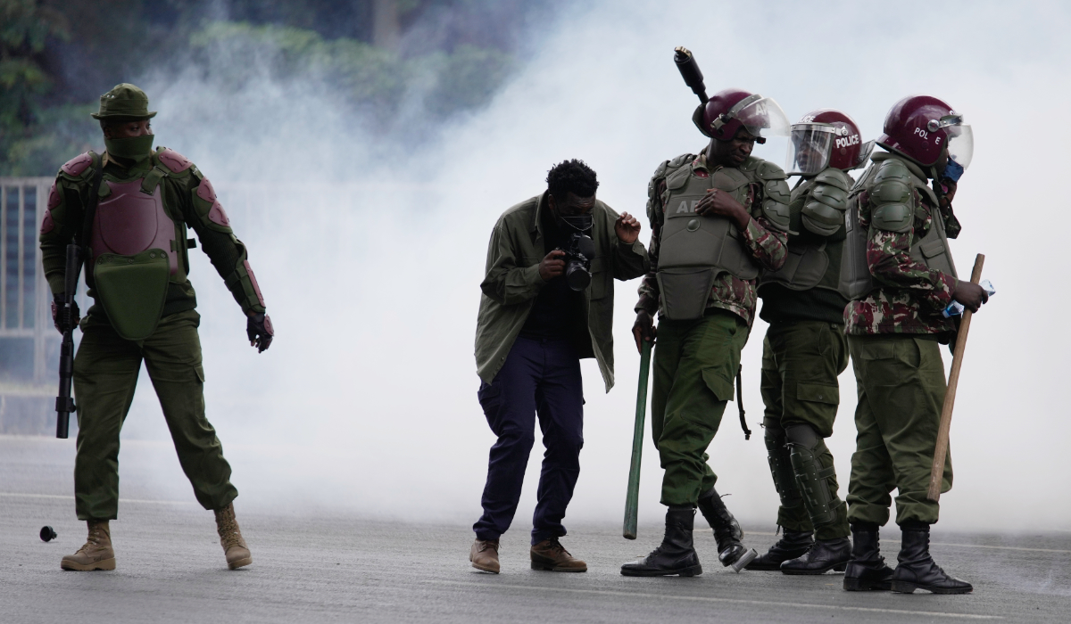Anti-riot police officers walk away from a cloud of tear gas during a demonstration marking two years since the 2024 anti-government protests in Nairobi, Kenya, Thursday, June 25, 2026. (AP)