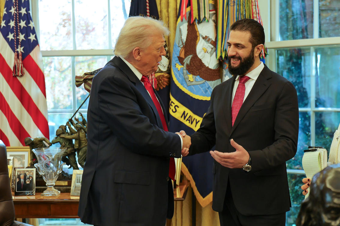 FILE - In this photo released by Syrian Presidency press office, President Donald Trump, left, shakes hands with Syria's President Ahmad al-Sharaa, at the White House in Washington, Monday, Nov. 10, 2025. (Syrian Presidency press office via AP, File)