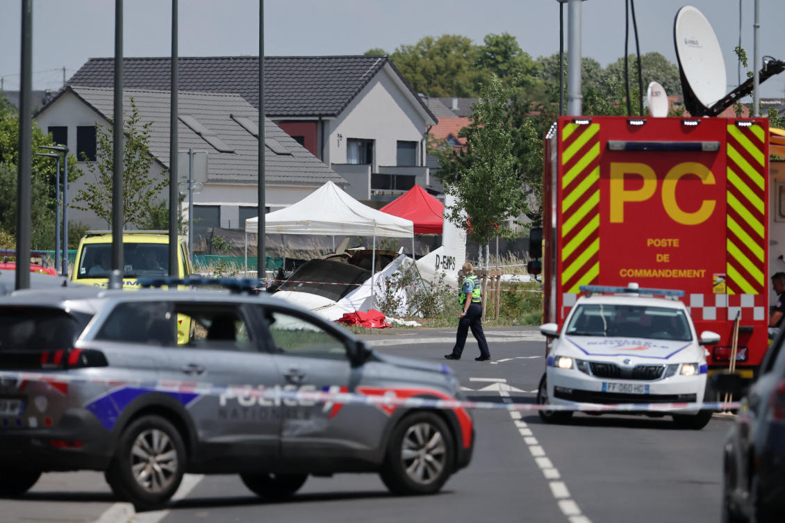 A rescuer works at the site of a plane crash in Tomblaine, France, June 28, 2026. REUTERS/Christian Hartmann