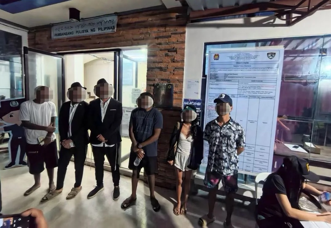 This photo released by the Naval Forces Eastern Mindanao one June 29, 2020 shows foreigners arrested in Siargao island for violating Philippine immigration laws. (NFEM)