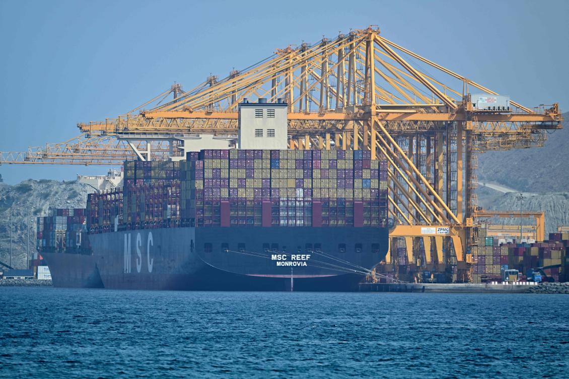 A container vessel docked at the Khor Fakkan Container Terminal on the UAE's Gulf of Oman coast on Sunday. (AFP)