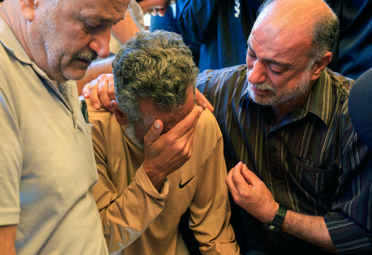Mourners at the funeral of Palestinian girl Alin Al-Farra, who was killed in an Israeli strike in Gaza on Monday. (Reuters)