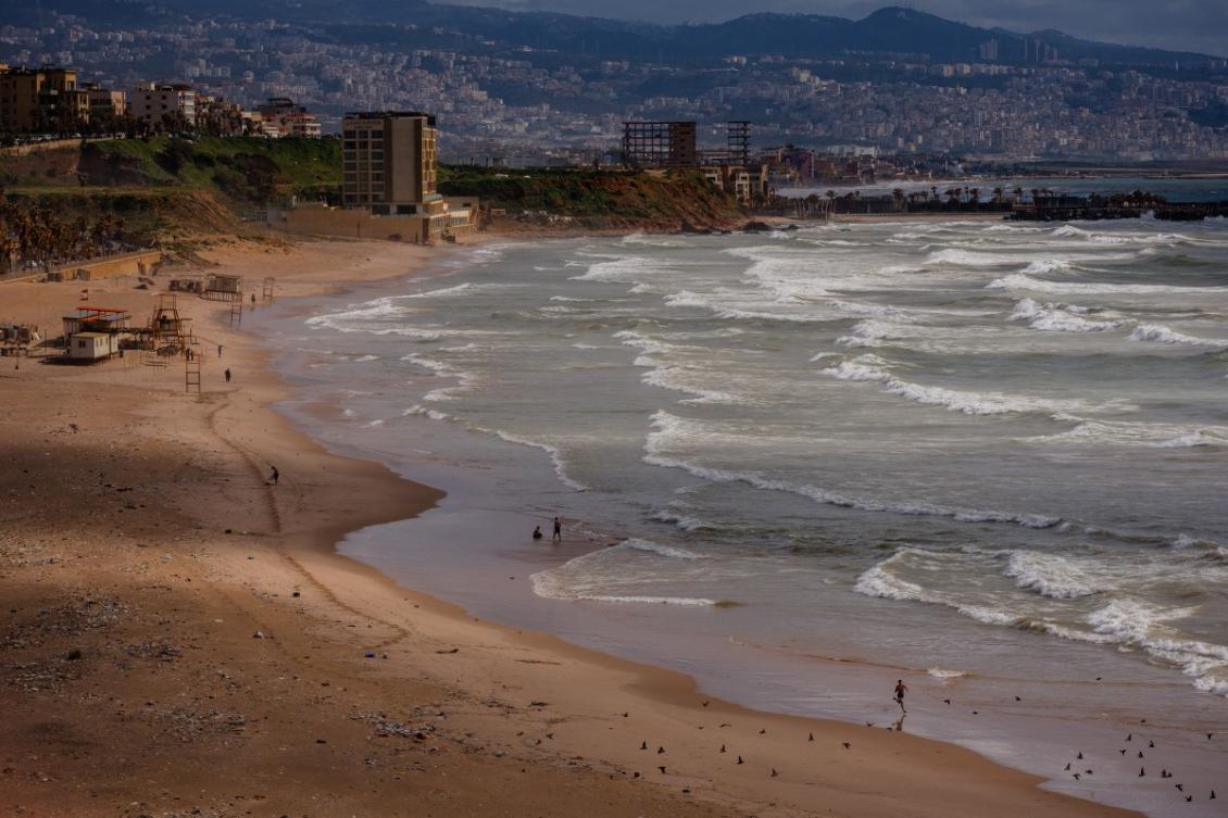 People walk along Beirut's Ramlet Al-Baida beach. (File/AFP)