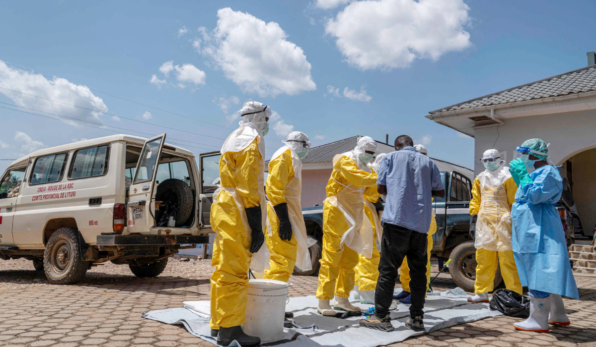 Response teams wear protective suits before burying a person suspected of having died from Ebola in Bunia, in the eastern Democratic Republic of the Congo, on May 25, 2026. (AFP)