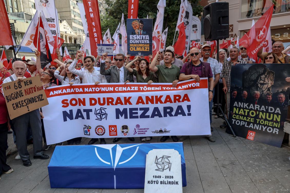 Protesters hold a banner reading "Final stop is Ankara, NATO to the grave!" in front of a coffin wrapped with the NATO flag during an anti-NATO demonstration in Ankara, on June 27, 2026 ahead of the NATO summit. (AFP)